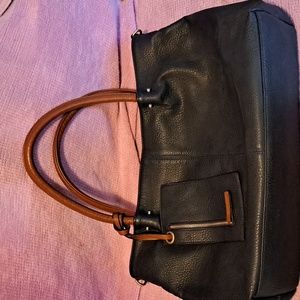 Large casual leather purse with laptop case and clutch.